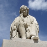 Achievement Statue of Dr. Johnson erected in 1838 opposite the house where he was born at Lichfield's Market Square. There are also statues of him in London and Uttoxeter. of Samuel Johnson