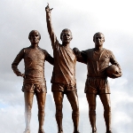 Achievement The United Trinity statue of Best (left), Denis Law (centre) and Bobby Charlton (right) outside Old Trafford of George Best