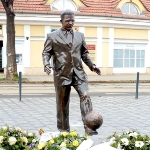 Achievement Statue of Ferenc Puskás in Budapest inspired by a photograph taken in Madrid in which the legendary player was teaching an ad hoc course in keepie uppie to street children of Ferenc Puskás