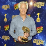 Achievement Chris Carter holding the Saturn Award at its 42nd ceremony. of Chris Carter