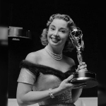 Achievement Audrey Meadows holding Emmy Award she received in 1955. of Audrey Meadows