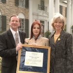 Achievement Events marking designation of Graceland Mansion, home of Elvis Presley, Memphis, Tennessee, as a National Historic Landmark, with appearances by, left to right, Elvis Enterprises chief Jack Soden, actress Priscilla Presley, and Secretary Gale Norton. of Priscilla Presley