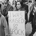 Achievement Laurann Wakefield with one of the signs for Dr. Benjamin Spock draft resistance movement is seen here. "We're your Babies," draft foes tell Spock. The pickets paraded peacefully during the rush hour. of Benjamin Spock