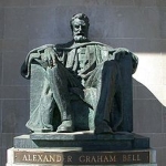 Achievement Bell statue by A. E. Cleeve Horne, similar in style to the Lincoln Memorial, in the front portico of the Bell Telephone Building of Brantford, Ontario, The Telephone City. Courtesy: Brantford Heritage Inventory, City of Brantford, Ontario, Canada. of Alexander Bell
