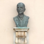 Achievement Bust of F. Pregl with a plaque at his birthplace in Ljubljana near Križanke on Gosposka Street, where the Inn under the Rock now stands. The statue was made by the sculptor B. Putrih. of Fritz Pregl