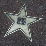 Achievement In 1989 Joplin received a star on the St. Louis Walk of Fame. of Scott Joplin
