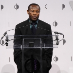 Achievement Olu Oguibe speaks onstage during the International Center Of Photography's 2018 Infinity Awards in New York City. of Olu Oguibe