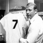 Achievement Former New York Yankees great Mickey Mantle holds up his #7 jersey in the locker room during the 1969 season at Yankee Stadium. Photo by B Bennett. of Mickey Mantle