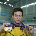 Achievement Sun Yang of Zhejiang shows all his medals after the awarding ceremony of men's 4x100m medley relay final at 13th Chinese National Games in North China's Tianjin municipality. of Sun Yang