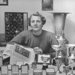 Achievement Fanny Blankers-Koen sitting behind her trophies.  of Fanny Blankers-Koen
