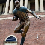 Achievement A 12-ft statue of Red Grange erected at the University of Illinois in his honor at the beginning of the 2009 football season. of Red Grange