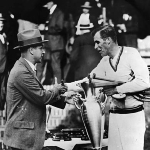 Achievement Bill Tilden collects the National Singles Cup for the sixth time from United States Lawn Tennis Association president Jones Mersereau at Forest Hills, New York. of Bill Tilden