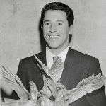 Achievement Mario Andretti holds the Martini & Rossi American Driver of the Year award. of Mario Andretti
