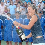 Achievement Victoria Azarenka sprays champagne at the trophy ceremony after defeating Serena Williams during the final of the Western & Southern Open in August at Lindner Family Tennis Center in Cincinnati, Ohio. Photo by Matthew Stockman. of Victoria Azarenka