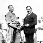 Achievement Cleveland pitcher Cy Young receives a medal from Boston's Mayor Curley. of Cy Young