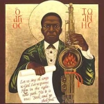 Achievement Icon painting of St. John Coltrane, 1991, painted by iconographer Deacon Mark Dukes African Orthodox Church and commissioned by his Eminence the Most Reverend Franzo Wayne King D.D. Archbishop of the Jurisdiction of the West African Orthodox Church for the Saint John Coltrane African Orthodox Church -San Francisco, California. where it has been on constant display in the church's sanctuary since 1991 and has logo-like stature for the church and sainthood of John William Coltrane. of John Coltrane