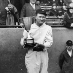 Achievement Walter Johnson, a pitcher for the Washington Senators, poses with a trophy he was awarded, the 1920s. of Walter Johnson